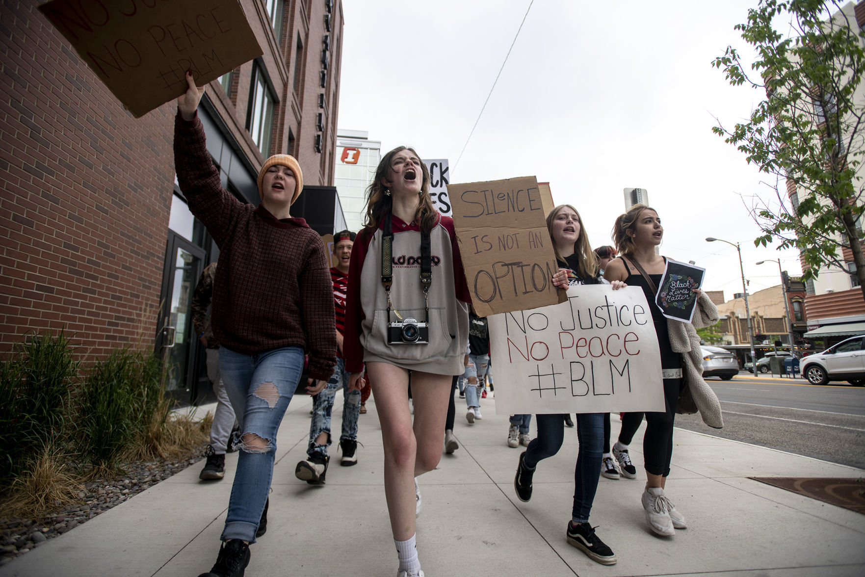 Marching down Higgins Avenue